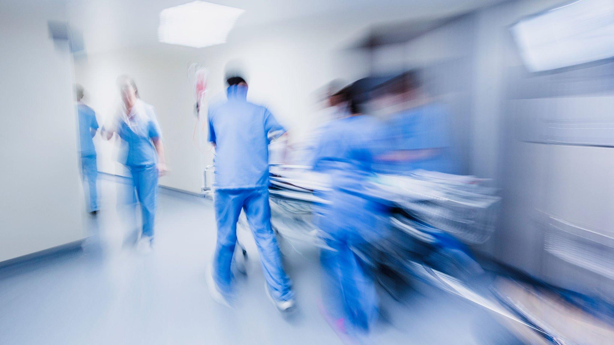a team of medical staff quickly responsed for critical patient and taking him to the emergency ward